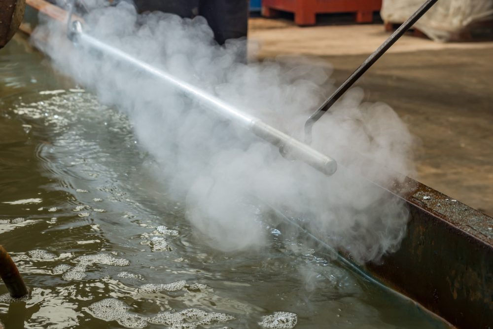 What is galvanized Iron: an iron pipe being galvanized at B.B. Price